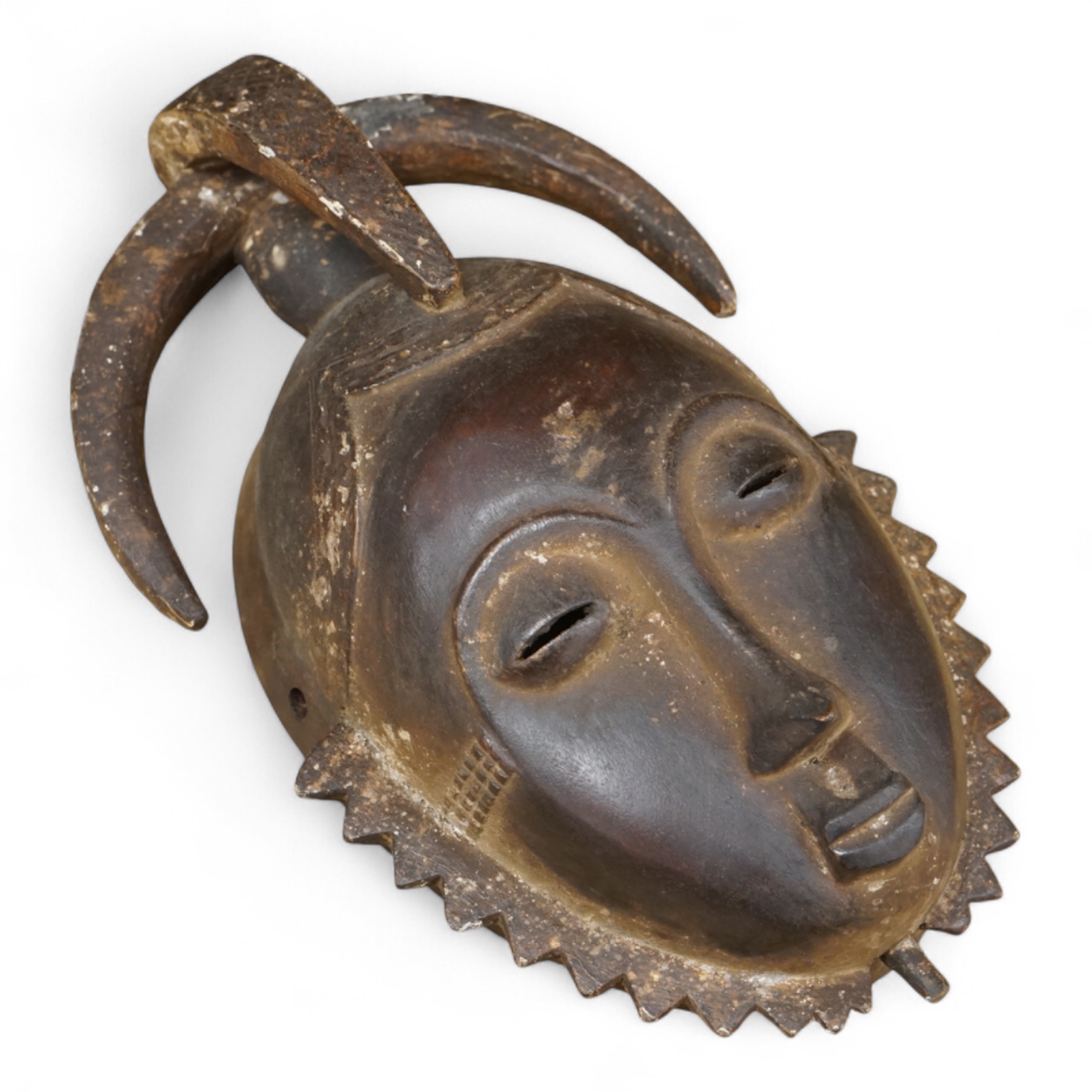 A Yaure carved African mask, from the Ivory Coast, 32cm high